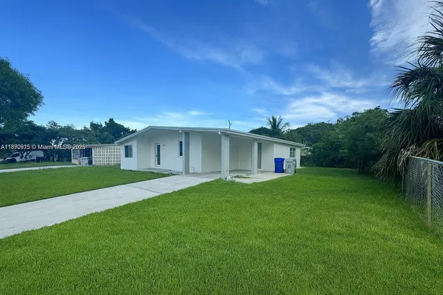 a view of a house with a back yard