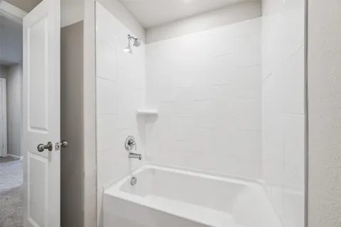 a close up of a bathtub curtain