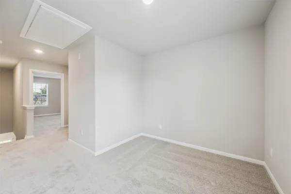 an empty room with a bathroom