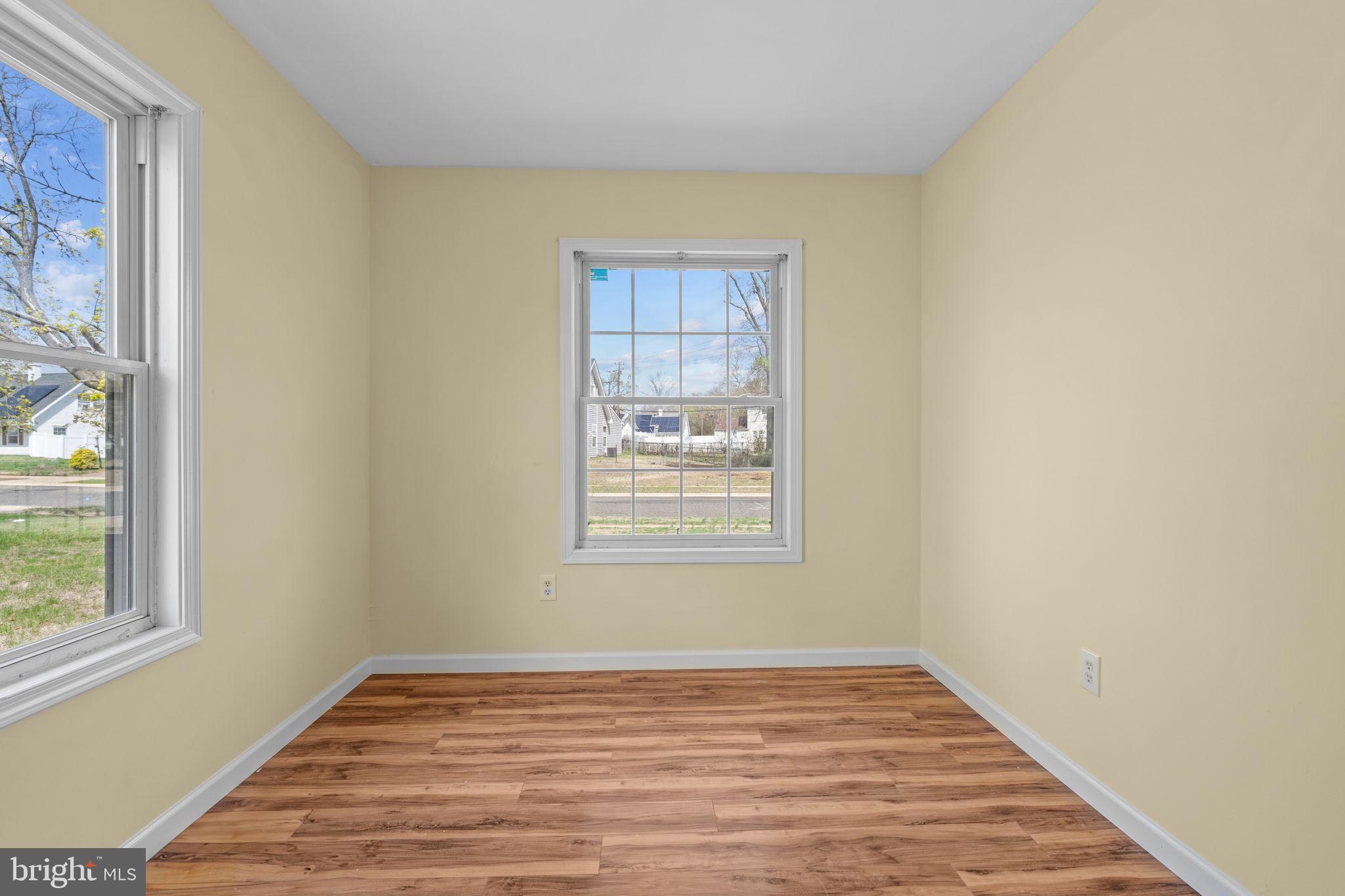 5 Bendix Lane Willingboro, NJ 08046 - Photo 11 of 20 a view of an empty room with wooden floor and a window