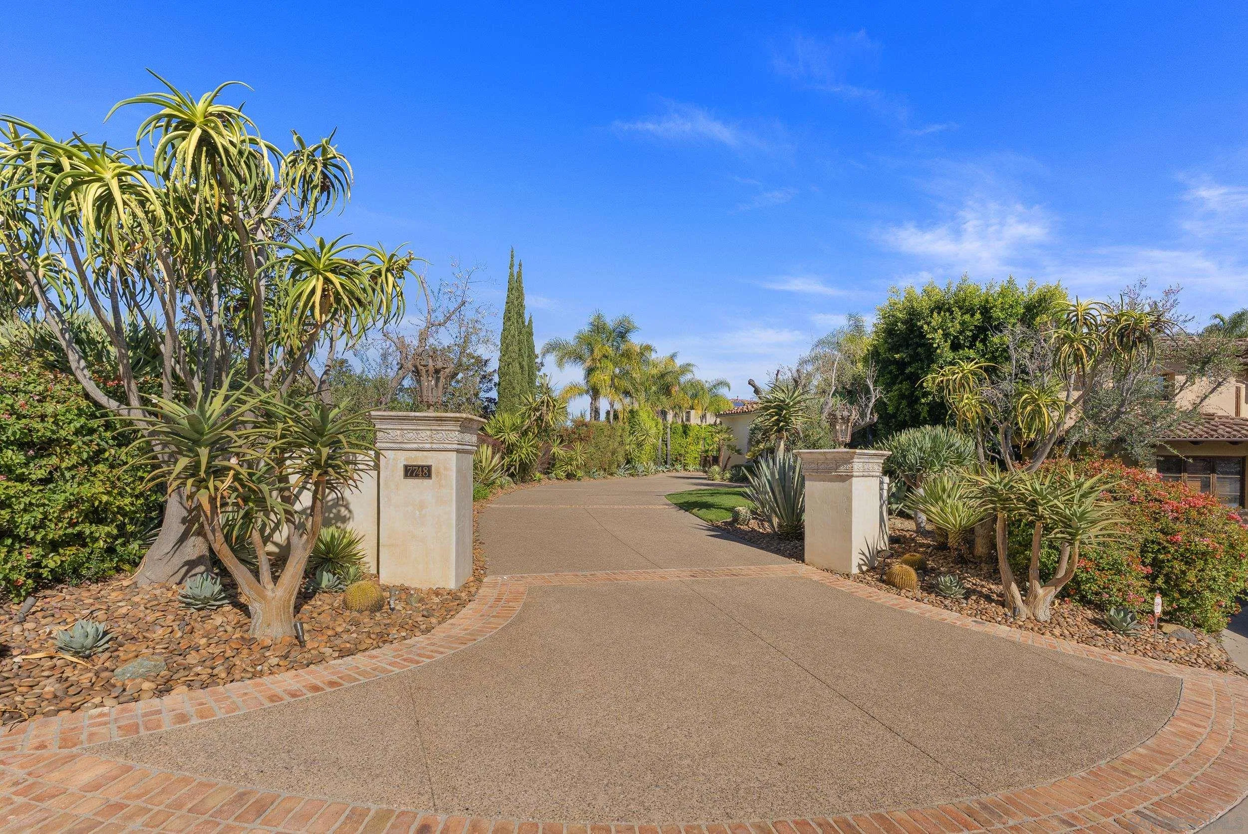 7748 Rd To Zanzibar San Diego, CA 92127 - Photo 1 of 1 a road with a building in the background