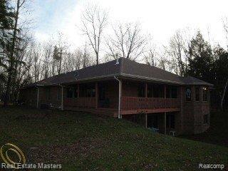 4655 Galbraith Line Road Jeddo, MI 48032 - Photo 4 of 25 RIVER SIDE VIEW OF WALKOUT BSMNT