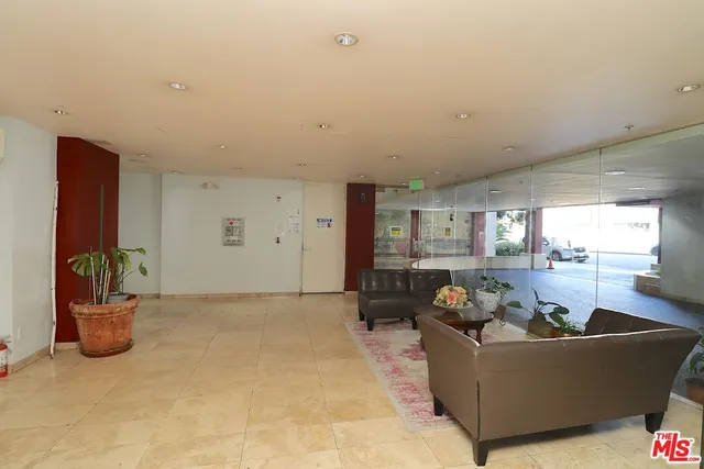 a living room with furniture and window