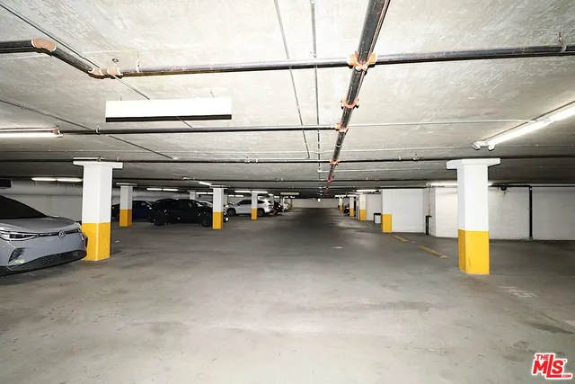 a view of parking garage with cars