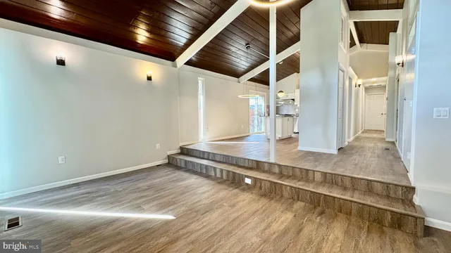 a view of room with wooden floor