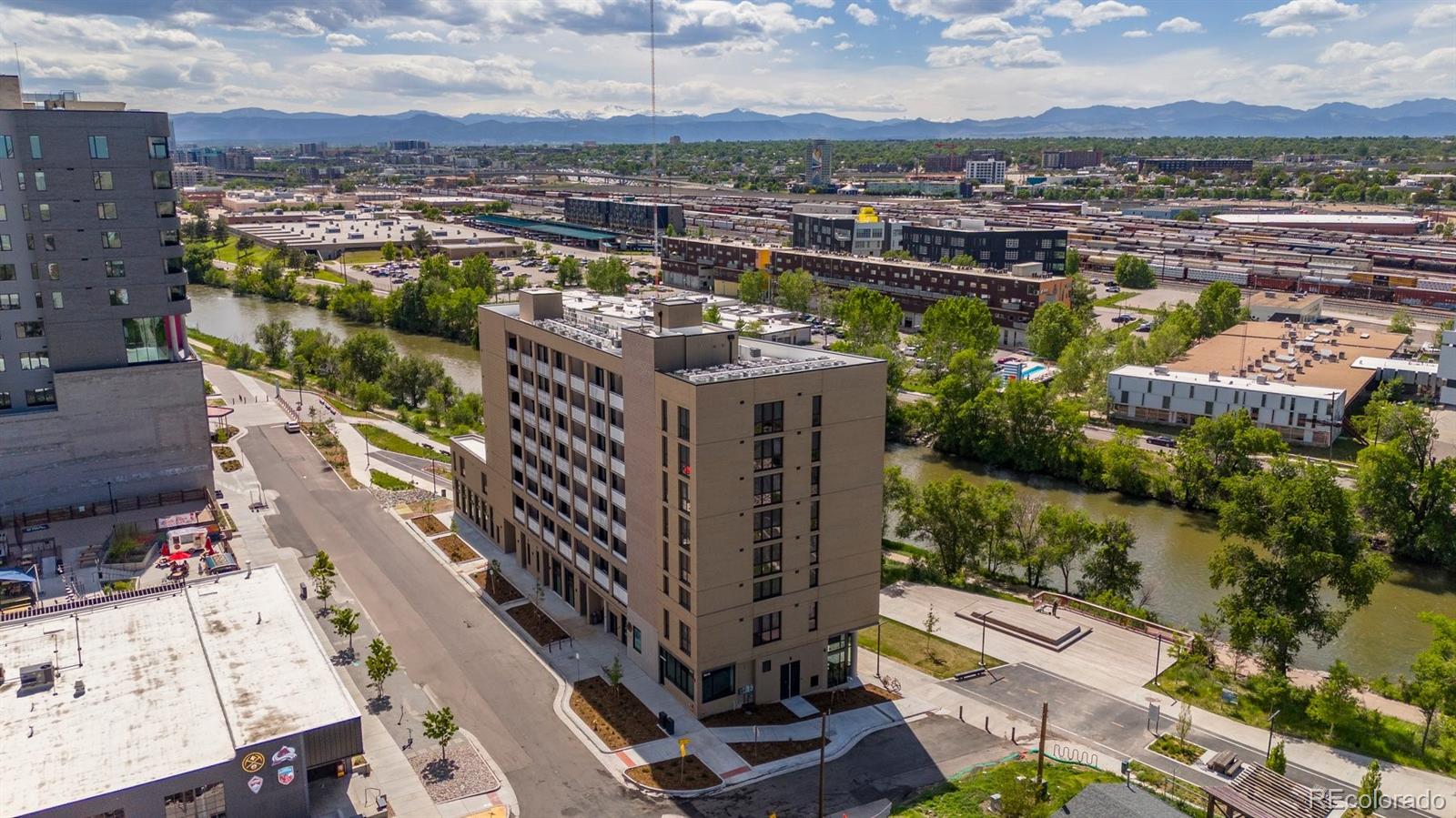 3575 Chestnut Place, Unit 702 Denver, CO 80216 - Photo 6 of 8 a view of a city with tall buildings