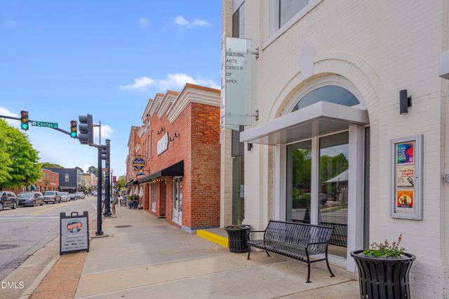 a view of a cafe with a couple of table and chairs