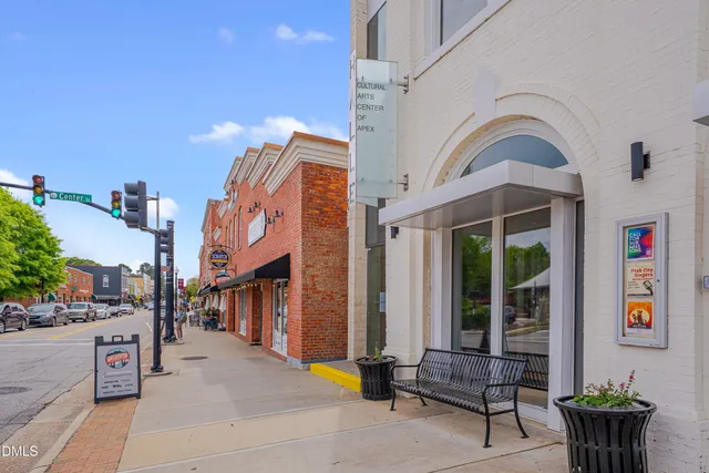 a view of a cafe with a couple of table and chairs