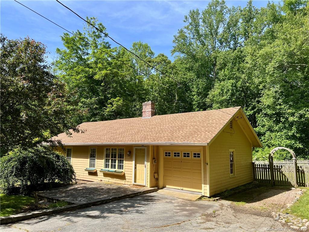 195 Oral School Road Groton, CT 06355 - Photo 1 of 1 a front view of a house with a garden