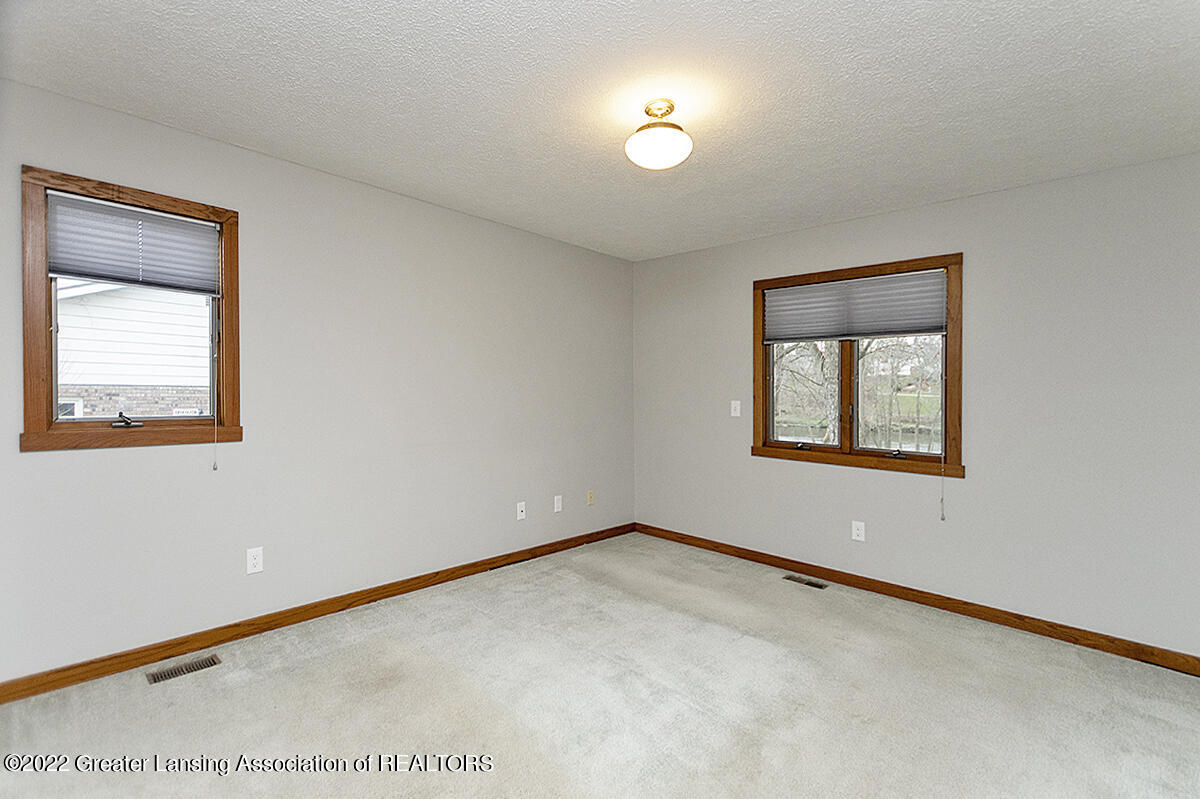 3233 Tecumseh River Road Lansing, MI 48906 - Photo 17 of 37 Primary Bedroom