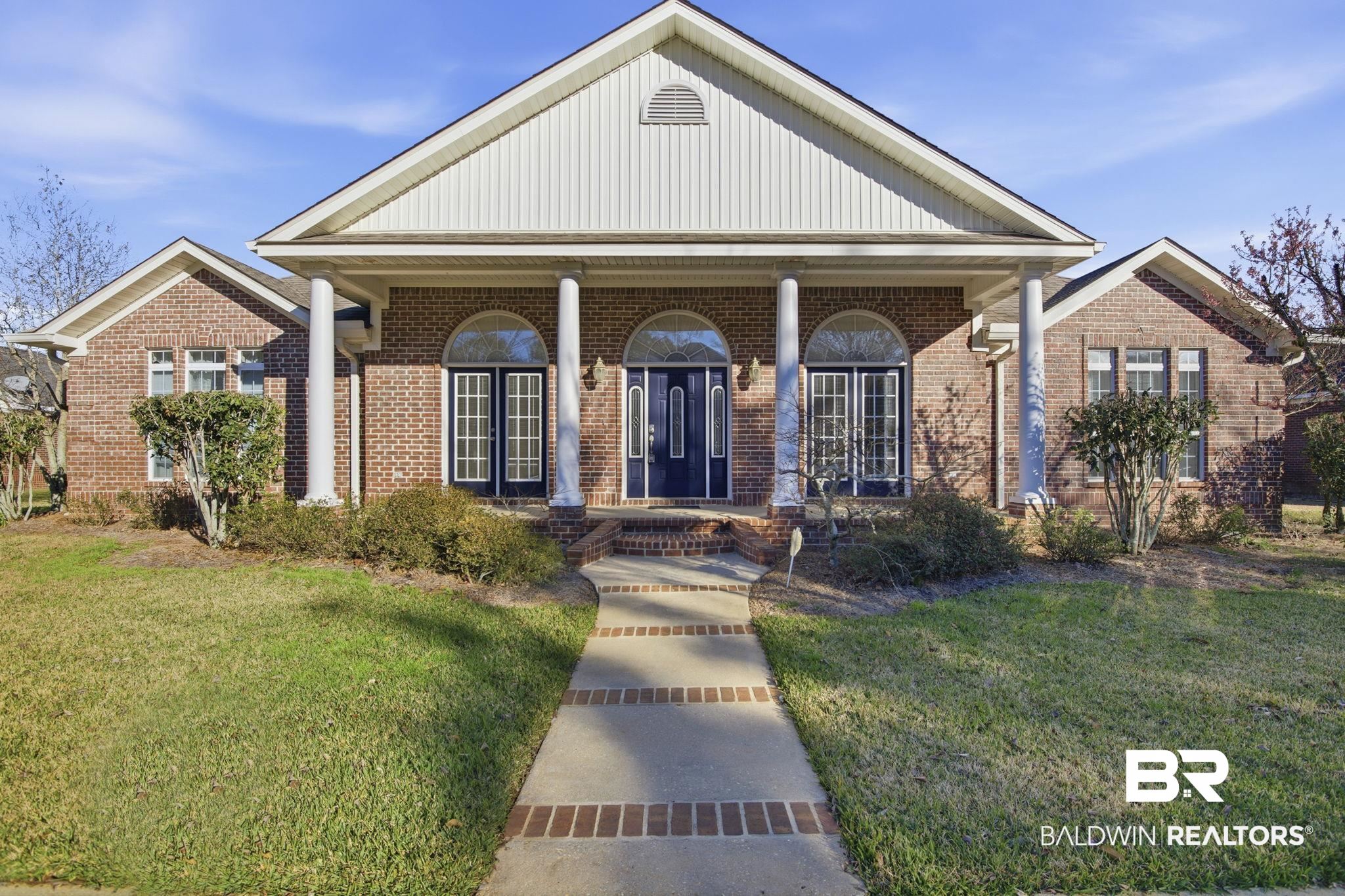 29634 St George Street Daphne, AL 36526 - Photo 3 of 47 View of front facade featuring a front lawn, a porch, and brick siding
