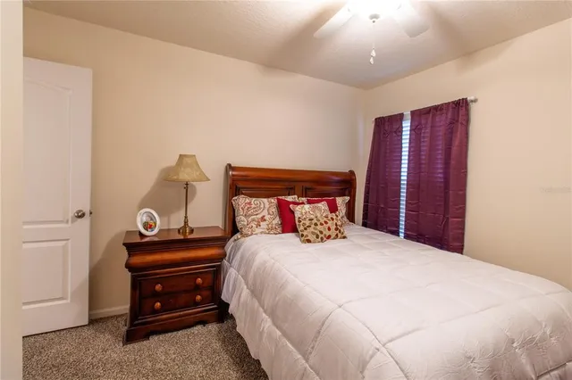 a bed room with a bed and a dresser