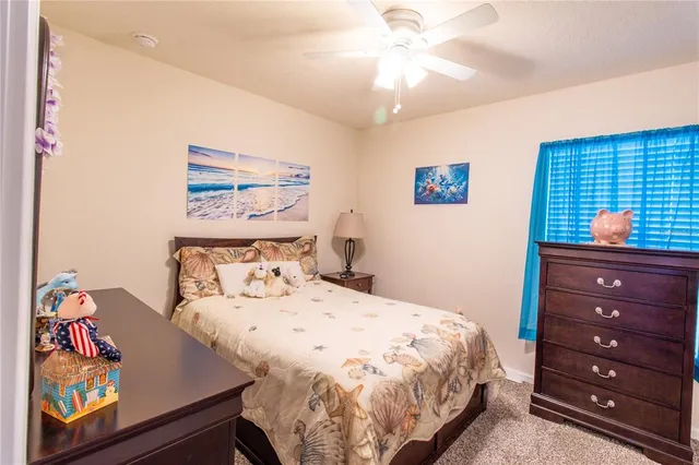 a view of a patio with a table chairs and a backyard