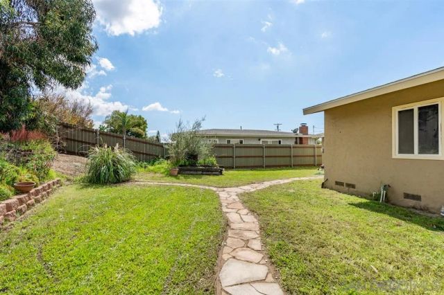 a view of a backyard with plants