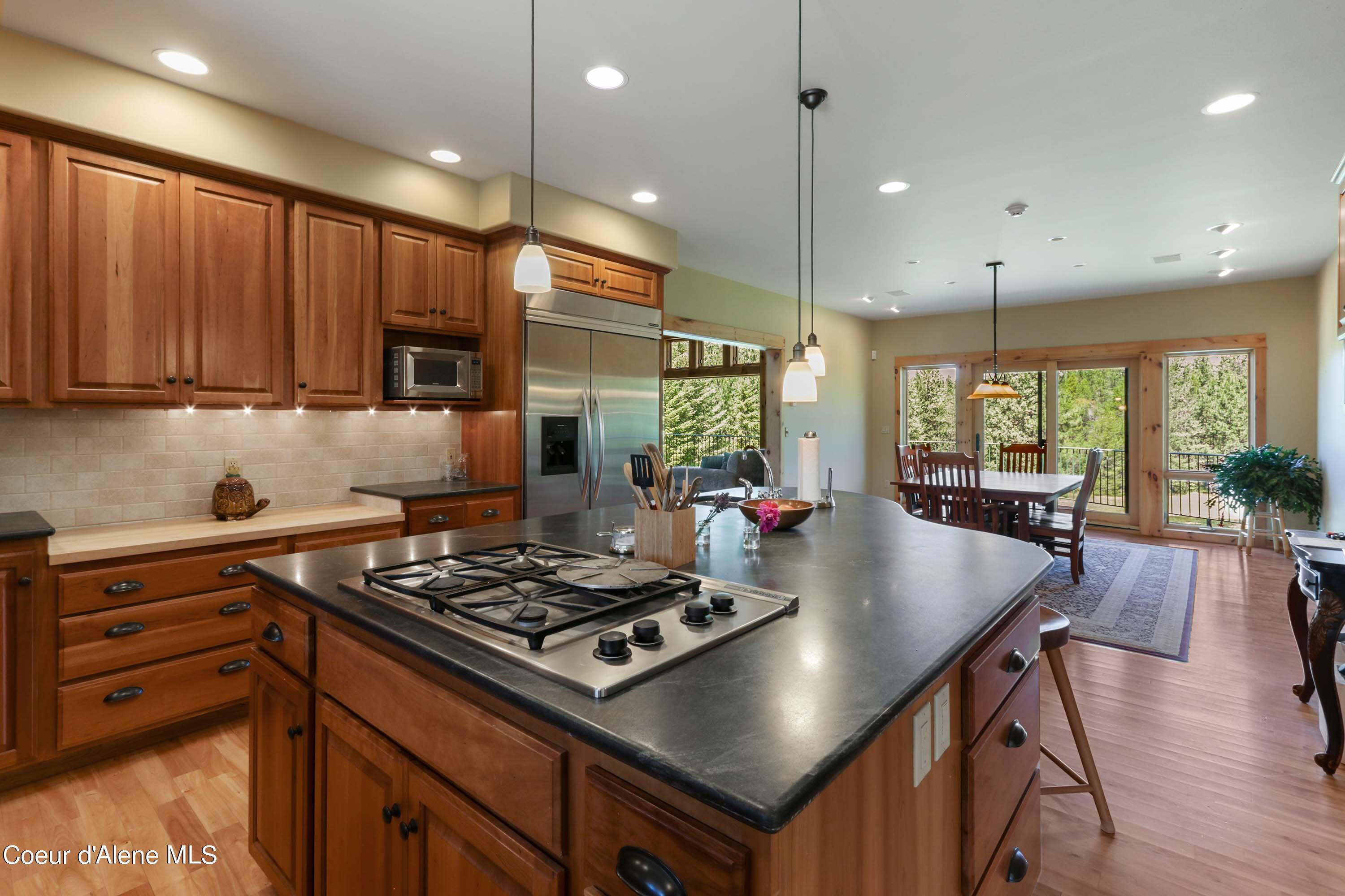 877 Heath Lake Road Sagle, ID 83860 - Photo 13 of 61 Kitchen Island to Dining