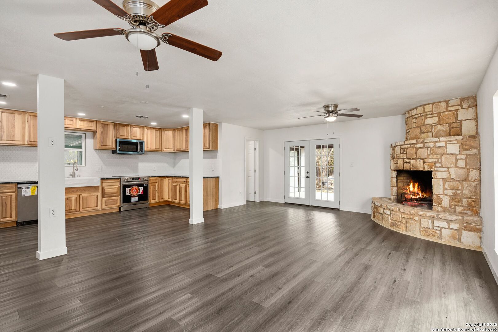 213 Verde Hills Drive Center Point, TX 78010 - Photo 3 of 37 a view of an empty room with a fireplace and window