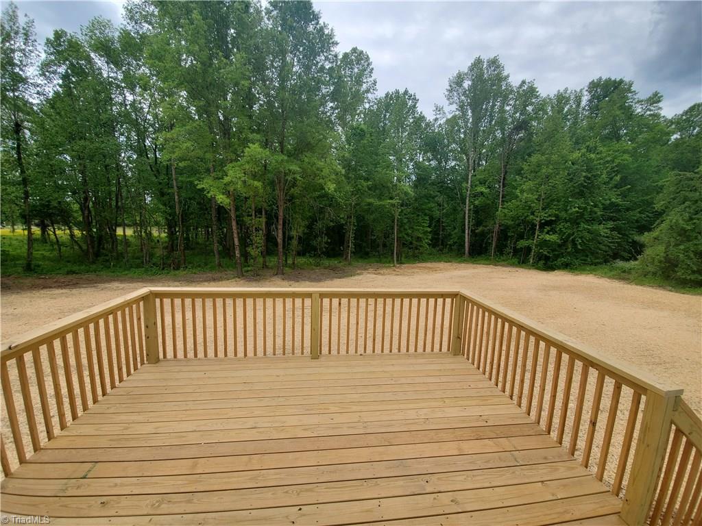 7913 Lester Road Stokesdale, NC 27357 - Photo 5 of 10 View of Deck and Back Yard from Back Door
