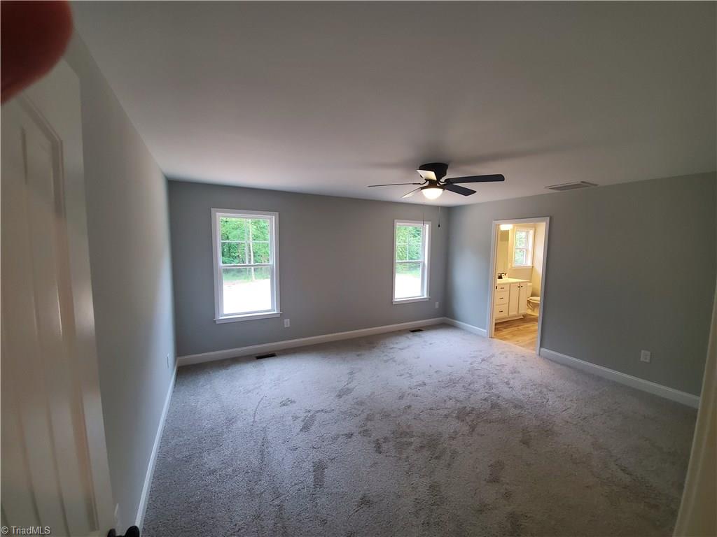 7913 Lester Road Stokesdale, NC 27357 - Photo 7 of 10 Master Bedroom