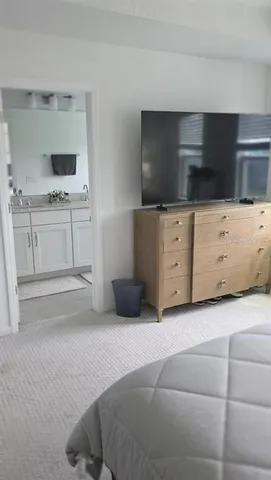 a living room with furniture and flat screen tv