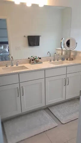 a bathroom with a sink and a mirror
