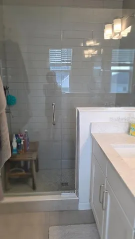 a bathroom with a sink and mirror