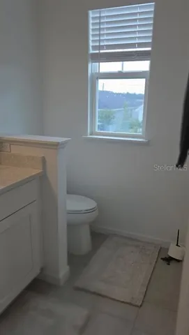 a bathroom with a toilet