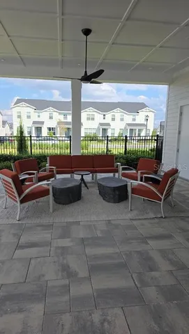 a outdoor space with lots of couches and dining table view
