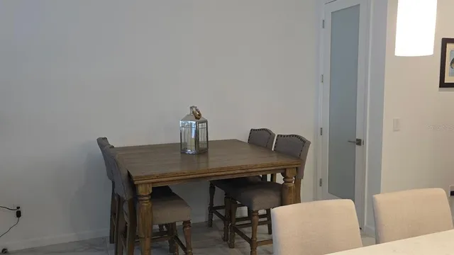 a view of a dining room with furniture and window