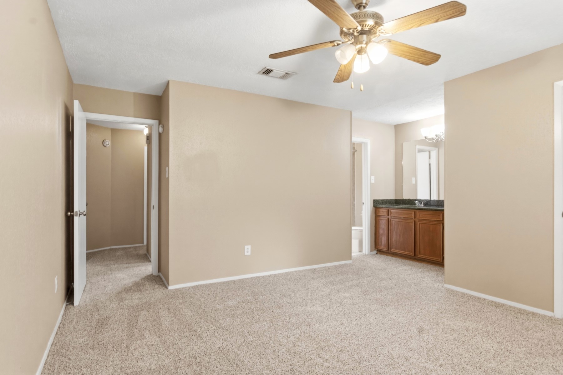 2531 North Spring Drive Spring, TX 77373 - Photo 14 of 24 a view of a kitchen with a sink and a ceiling fan