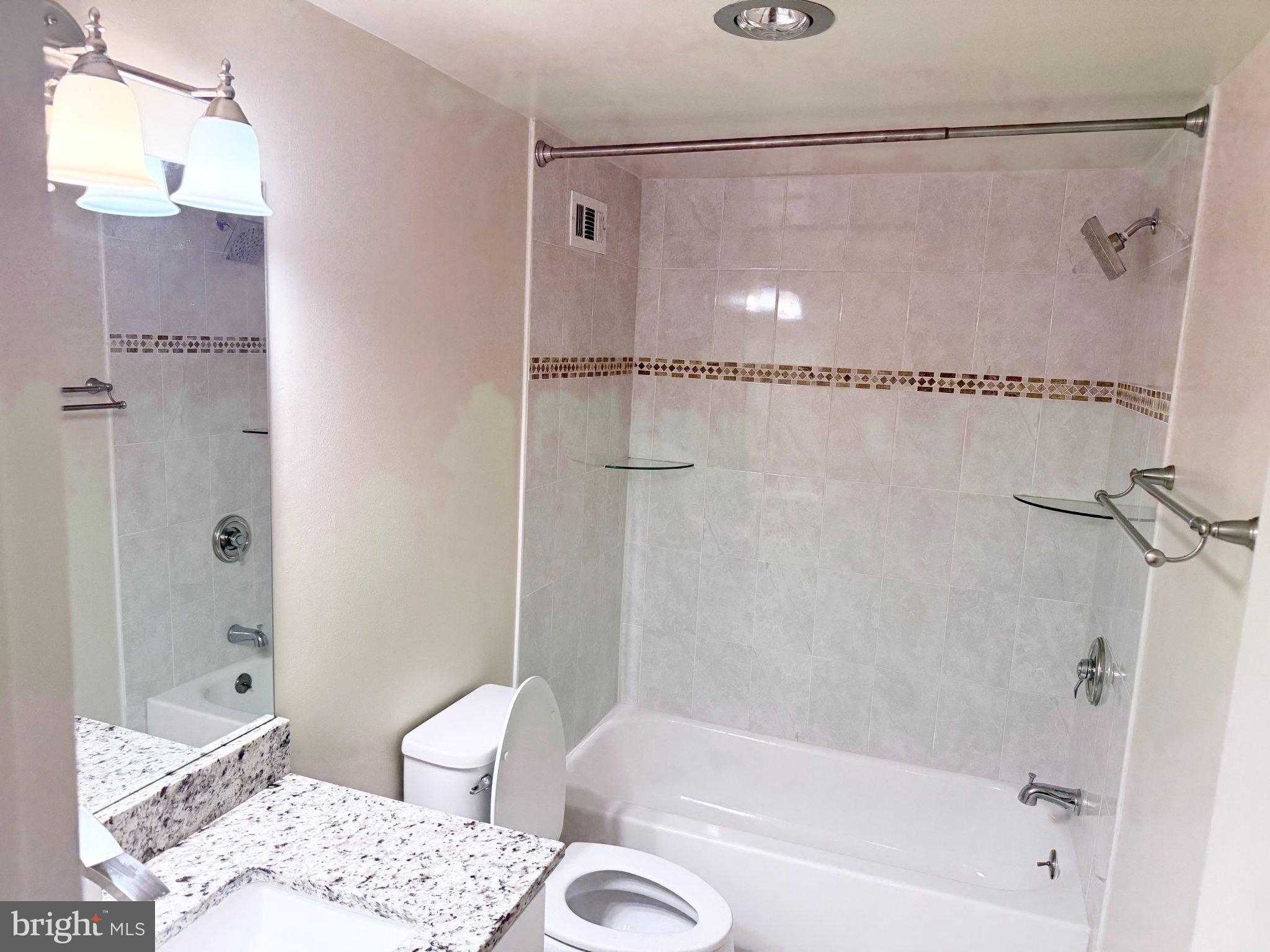 5225 Pooks Hill Road, Unit 1326 Bethesda, MD 20814 - Photo 16 of 24 a bath room with a bath tub and a shower