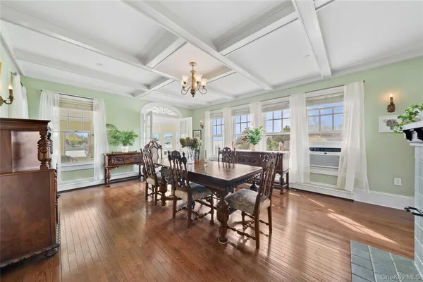 a view of a livingroom with furniture window and wooden floor