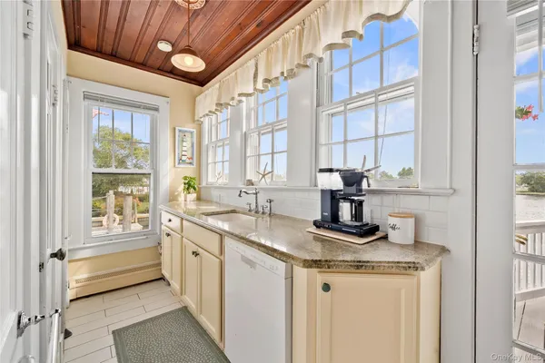 a kitchen with stainless steel appliances granite countertop a stove and a refrigerator