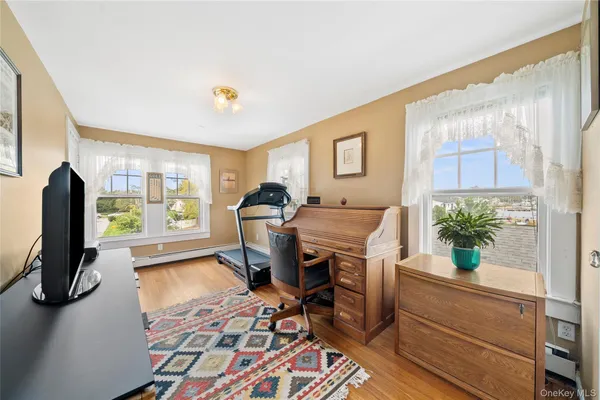 a bedroom with a bed furniture and a window