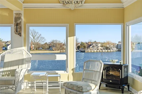 a view of a balcony with furniture and a window