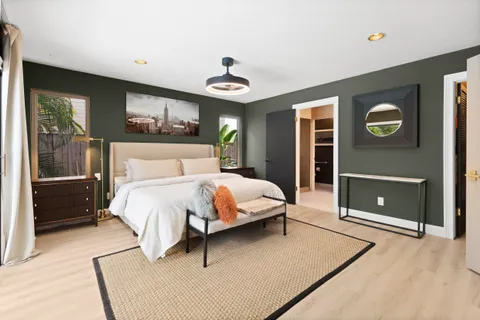 a bedroom with a bed and a fireplace