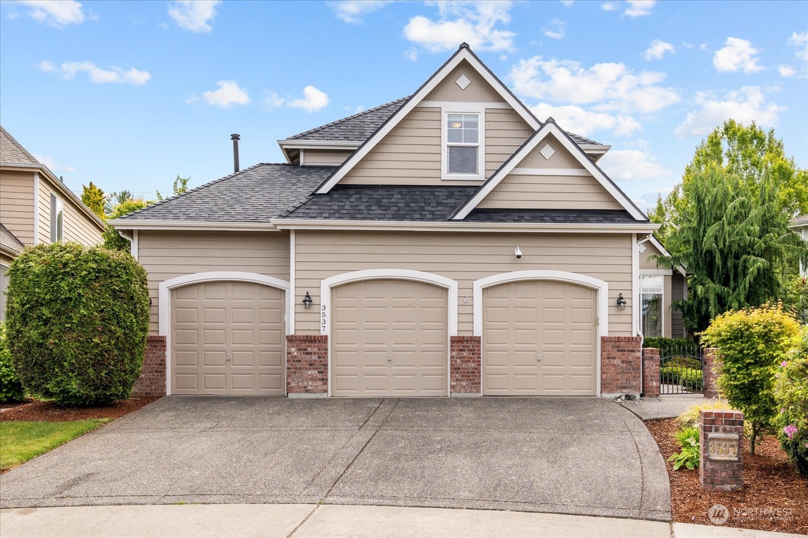3537 Northeast 24th Court Renton, WA 98056 - Photo 1 of 39 a front view of a house with garage