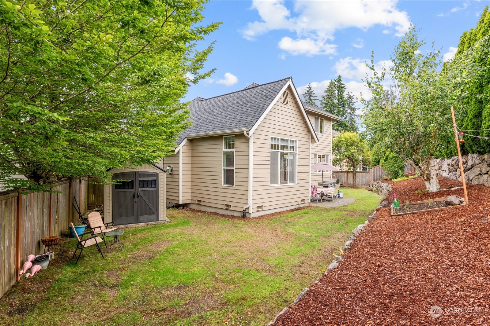 3537 Northeast 24th Court Renton, WA 98056 - Photo 32 of 39 a view of a house with backyard and sitting area