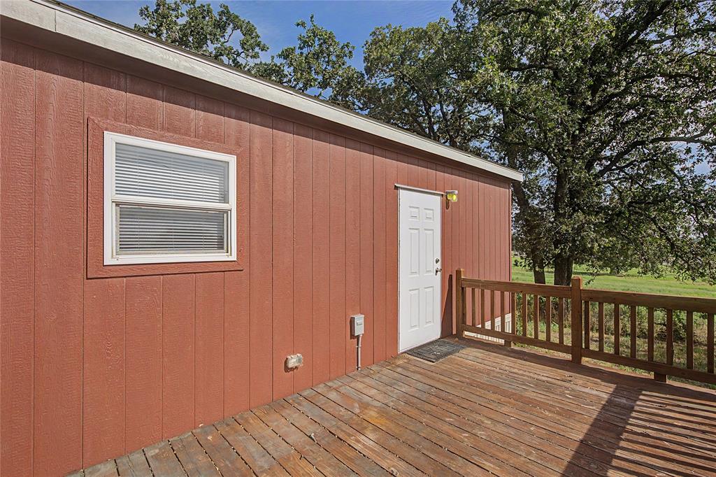 177 New Highland Road Springtown, TX 76082 - Photo 33 of 40 Expansive outdoor deck featuring wood flooring and a perimeter railing