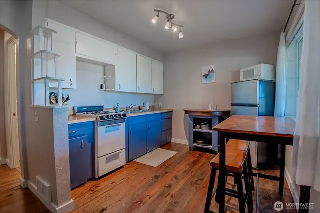 a bedroom with a bed and a lamp