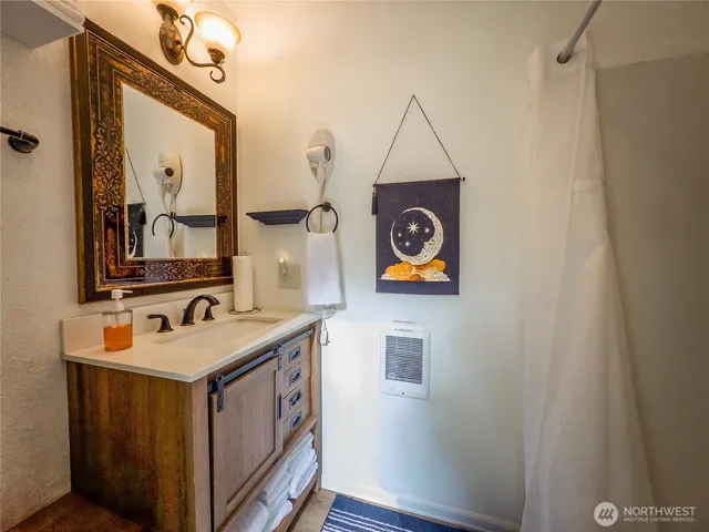 a view of a backyard with plants and a garden