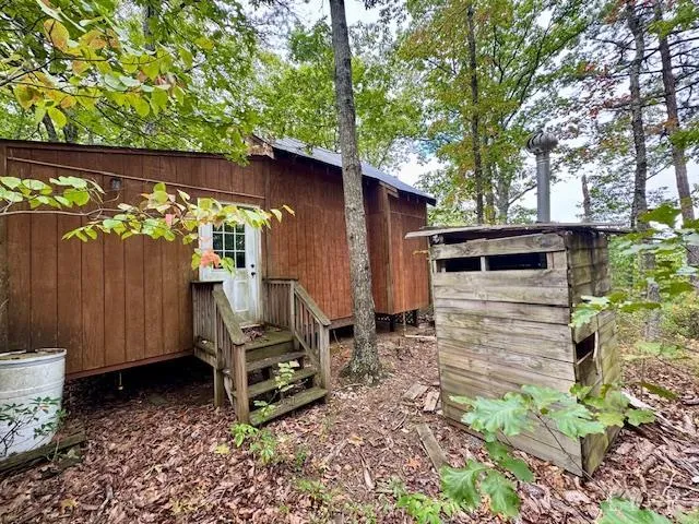 a view of a backyard with a small cabin
