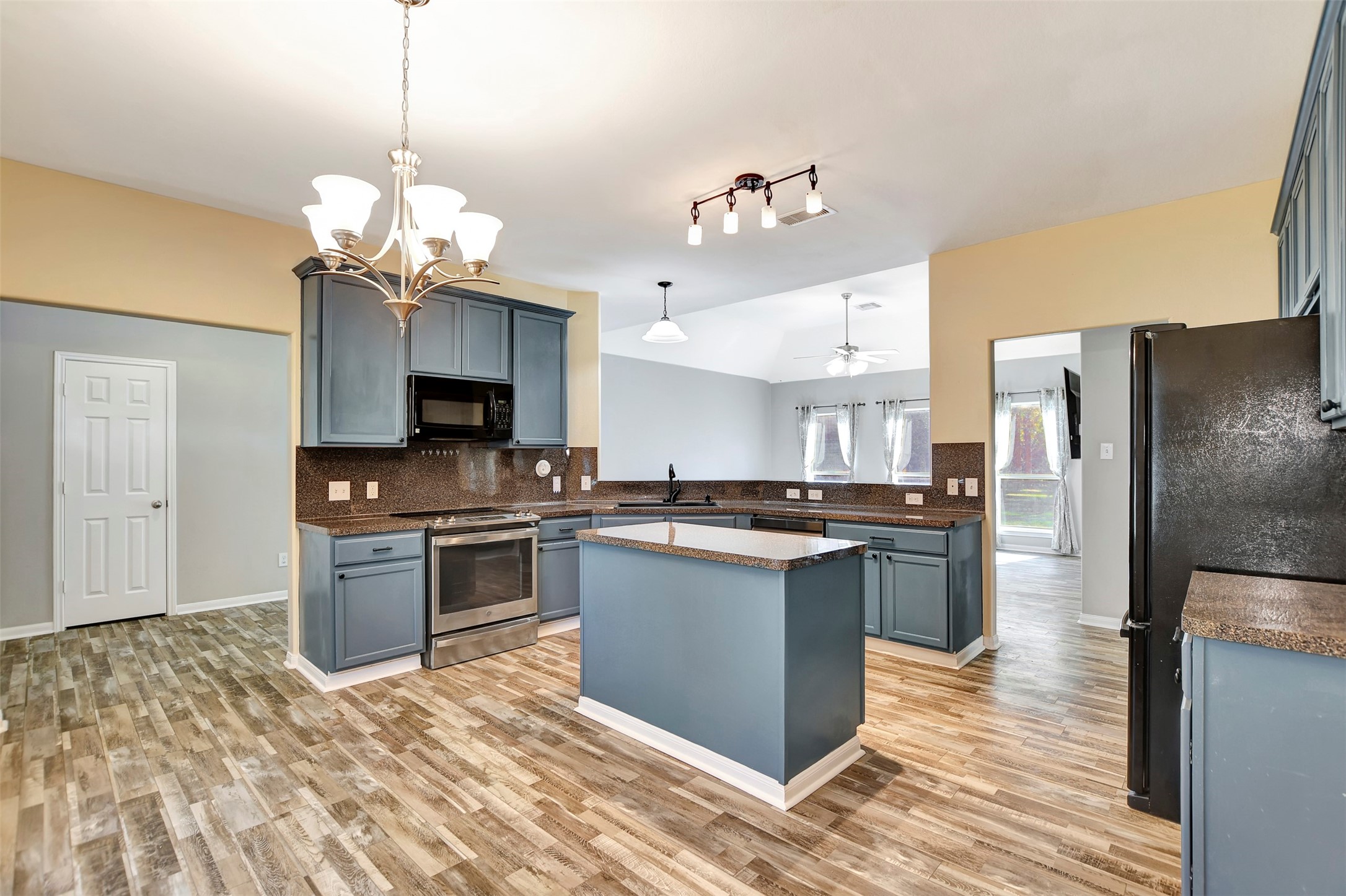 25896 Lake View Court West Hockley, TX 77447 - Photo 15 of 47 a kitchen with stainless steel appliances granite countertop a refrigerator a stove top oven a sink dishwasher and a refrigerator