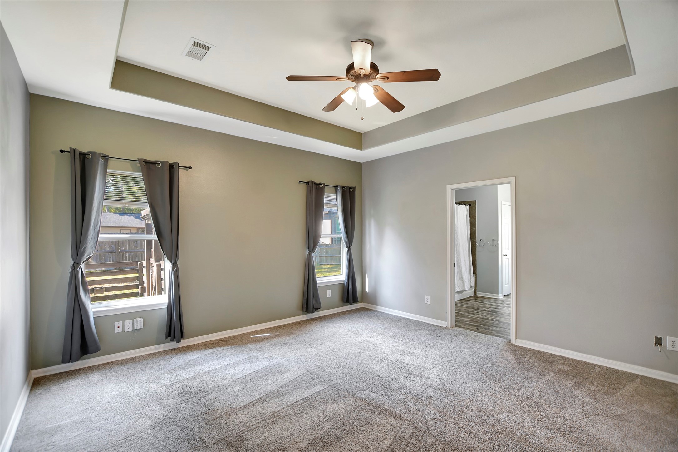 25896 Lake View Court West Hockley, TX 77447 - Photo 22 of 47 an empty room with windows and ceiling fan