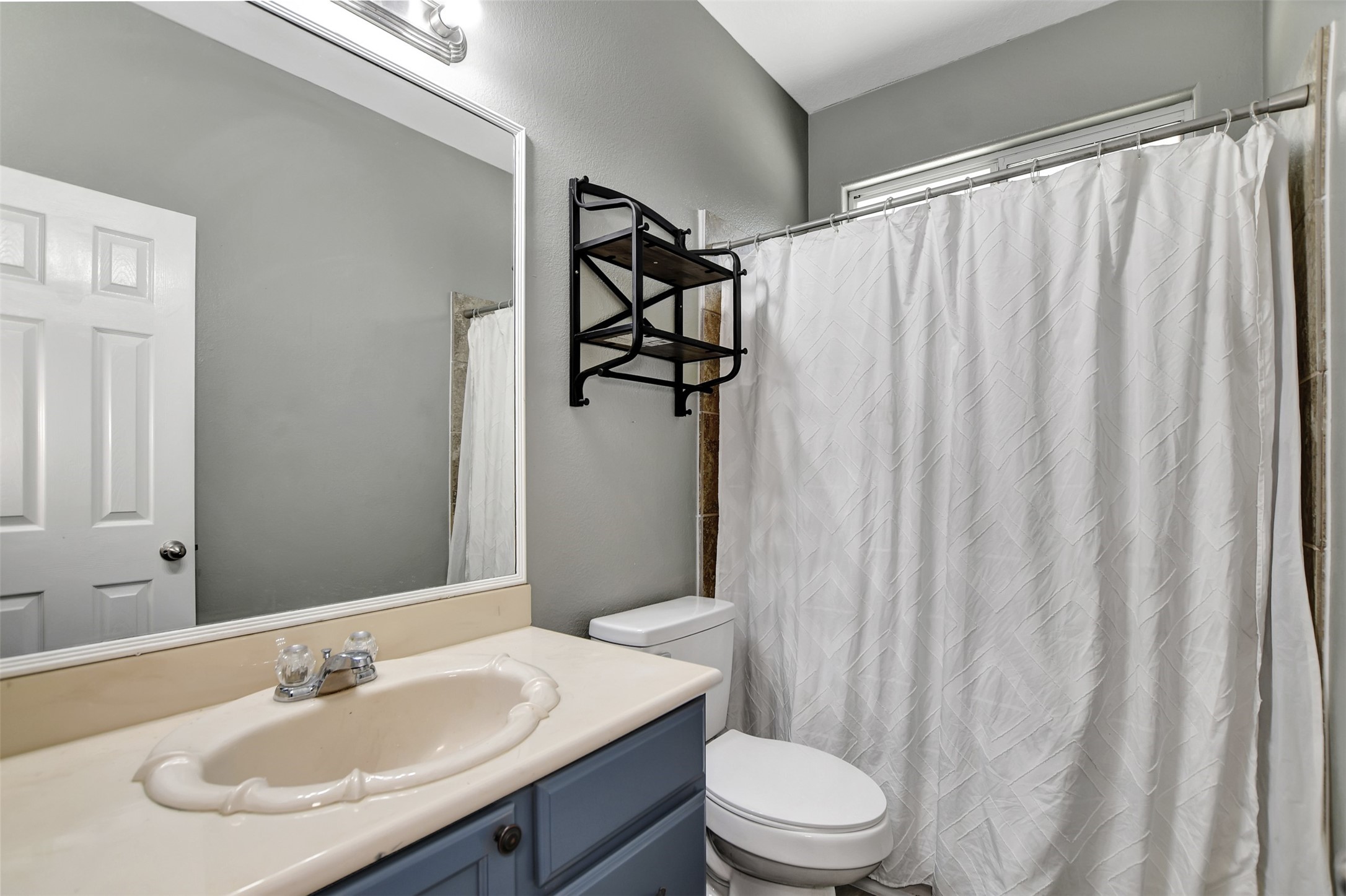 25896 Lake View Court West Hockley, TX 77447 - Photo 30 of 47 a bathroom with a sink and toilet