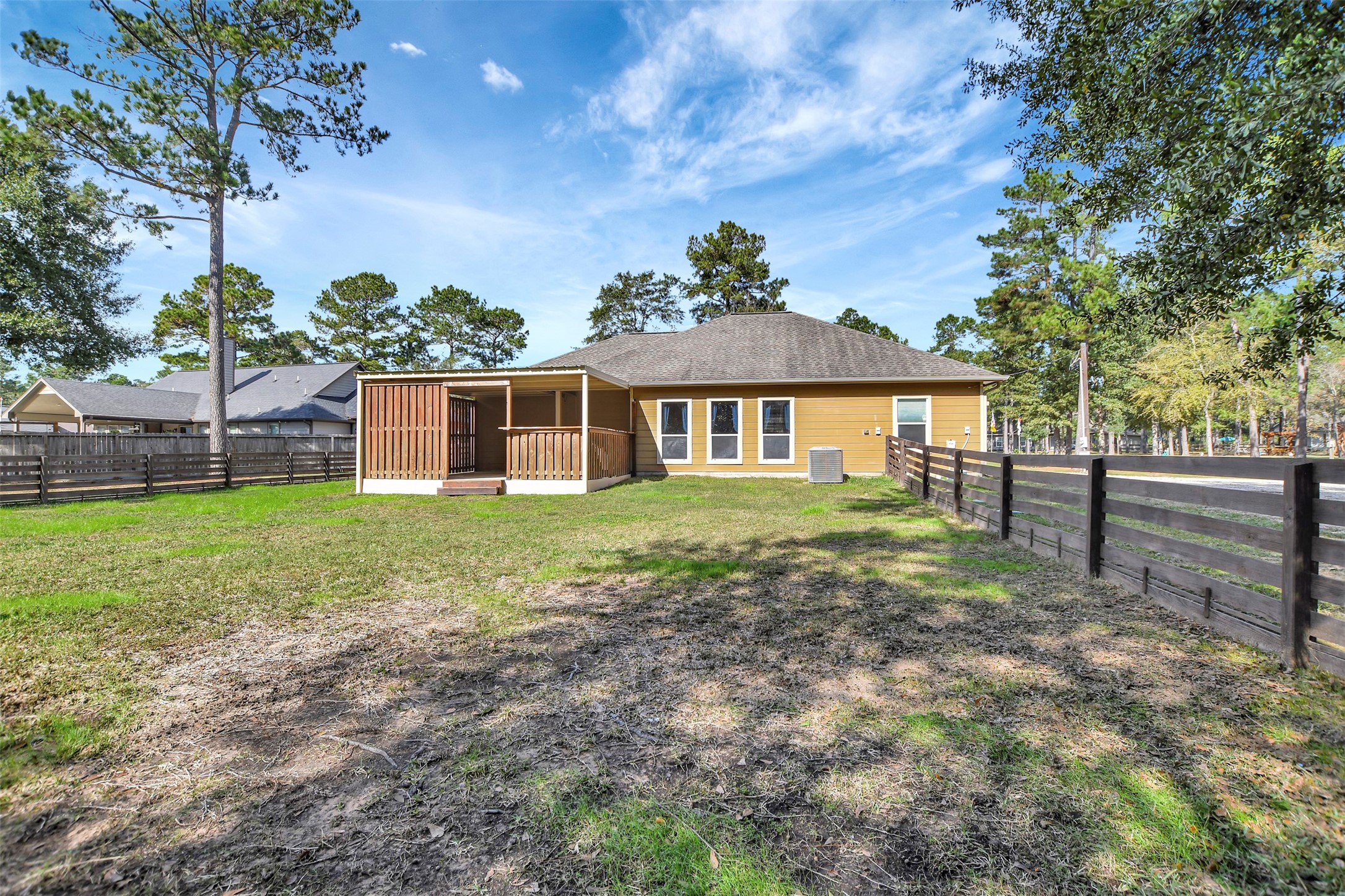 25896 Lake View Court West Hockley, TX 77447 - Photo 35 of 47 a view of a house with backyard and a tree