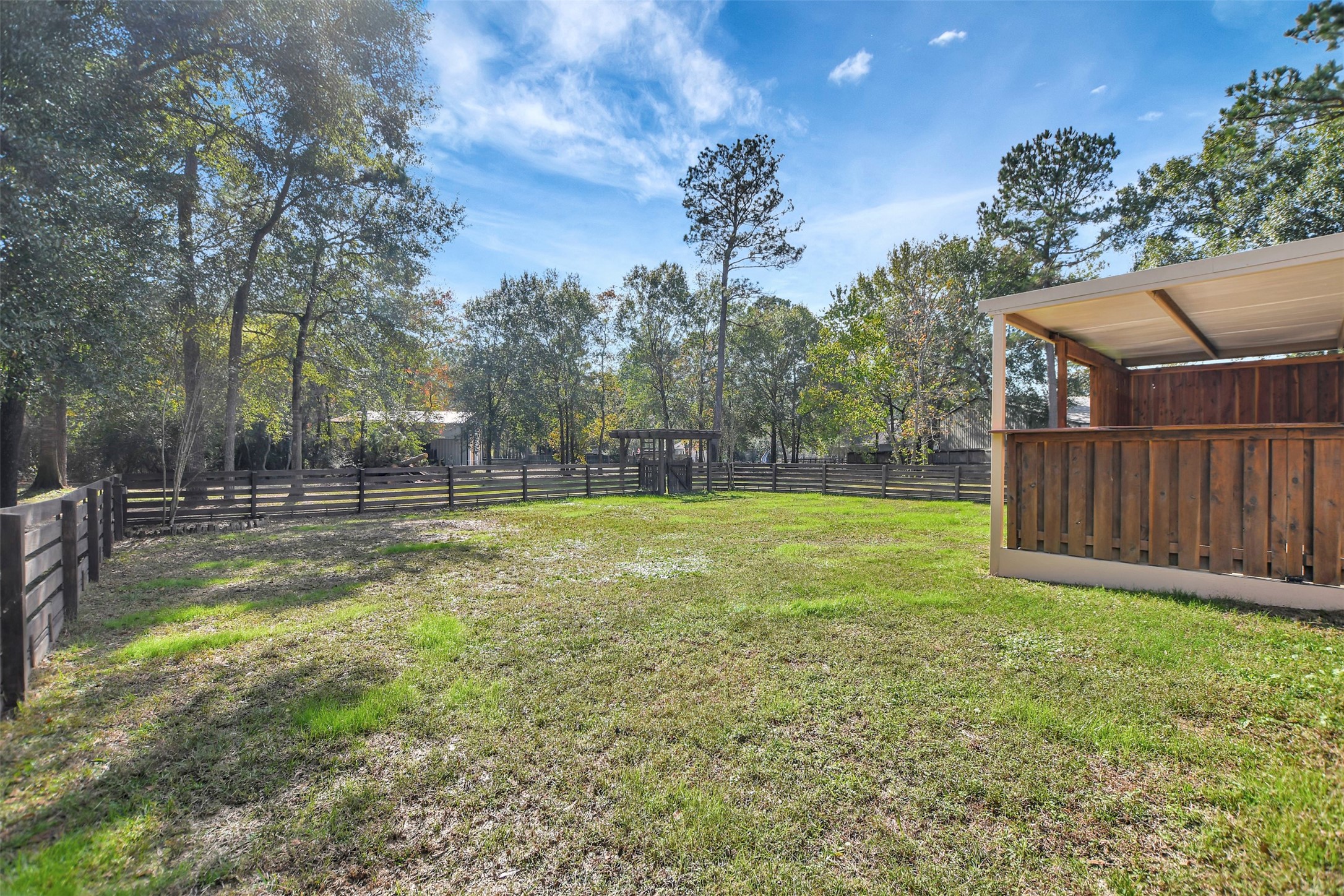 25896 Lake View Court West Hockley, TX 77447 - Photo 38 of 47 a view of a yard with a house in the background