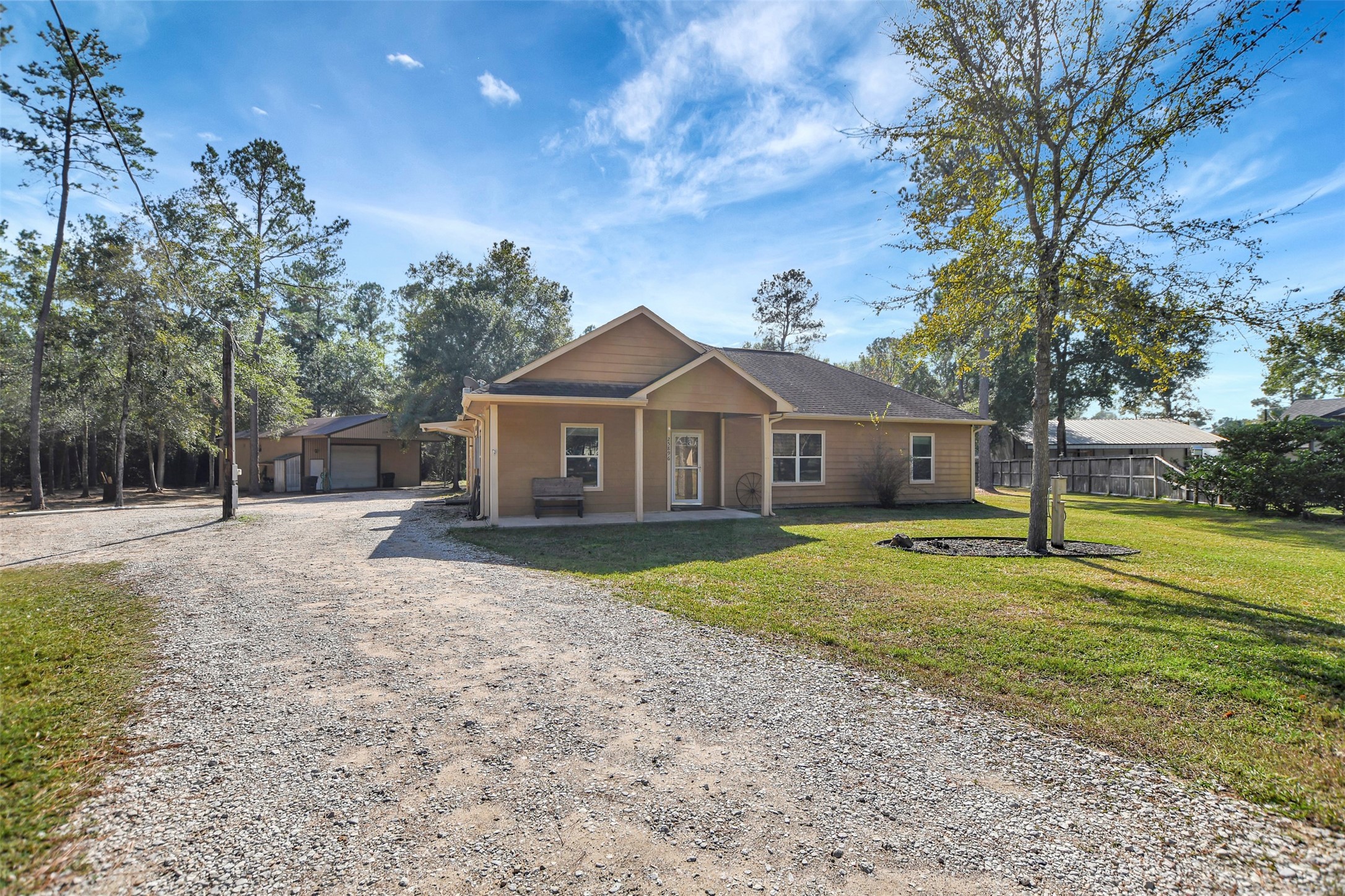 25896 Lake View Court West Hockley, TX 77447 - Photo 4 of 47 a front view of a house with a yard and trees