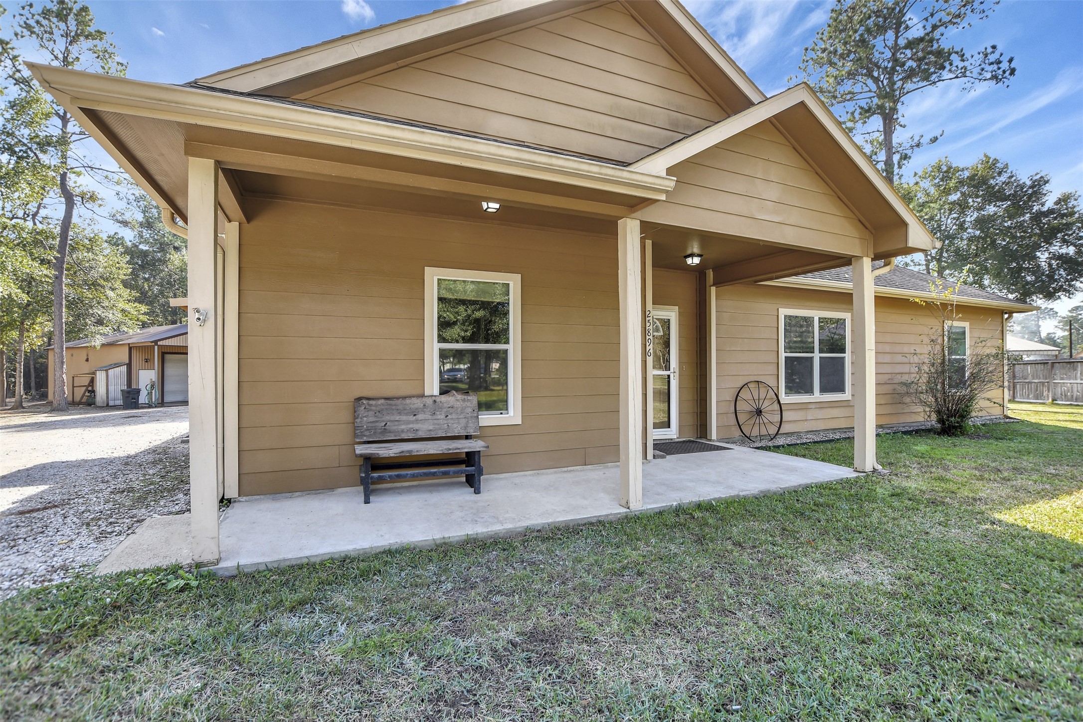 25896 Lake View Court West Hockley, TX 77447 - Photo 5 of 47 a front view of a house with a garden