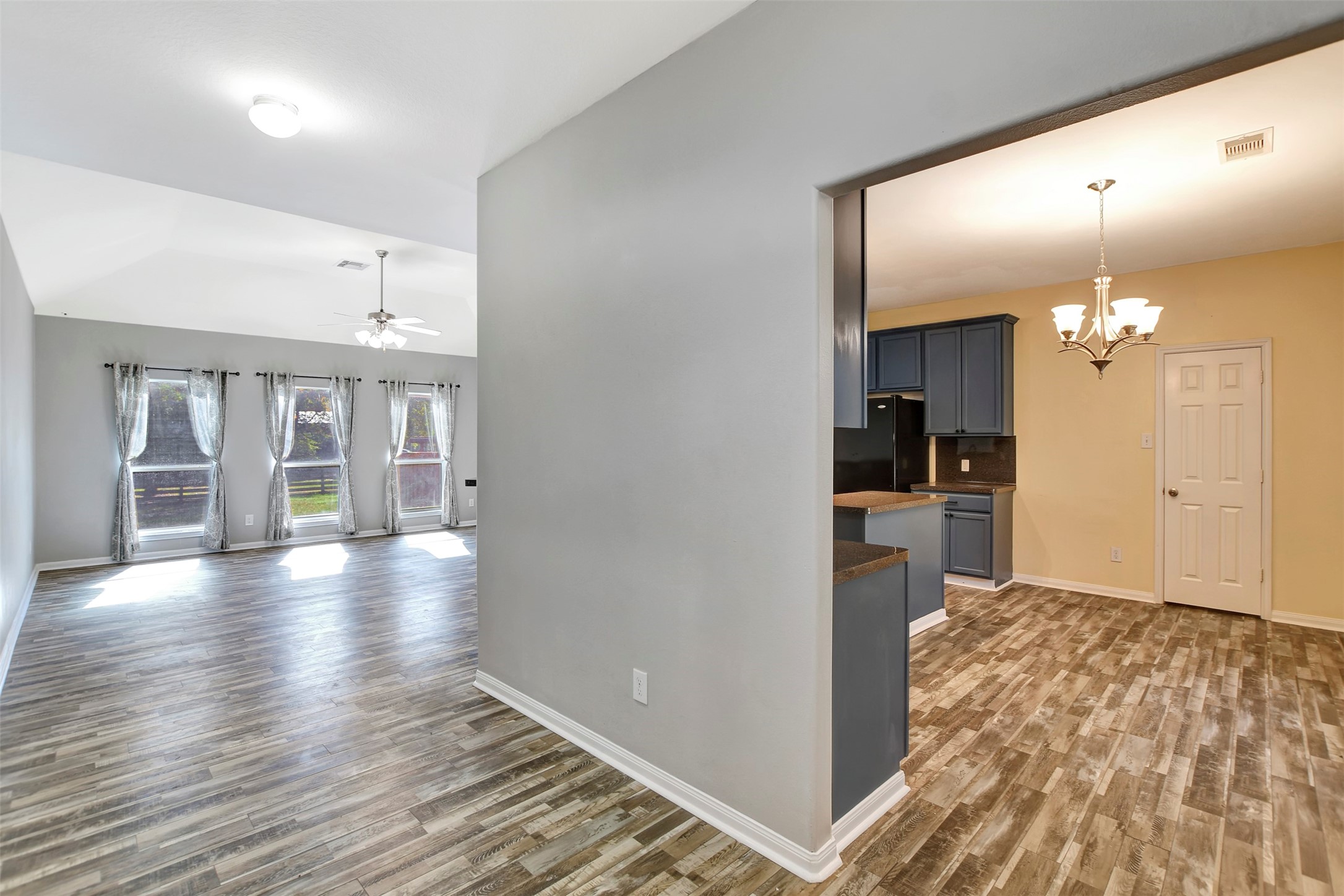 25896 Lake View Court West Hockley, TX 77447 - Photo 7 of 47 a view of a kitchen with wooden floor and a kitchen
