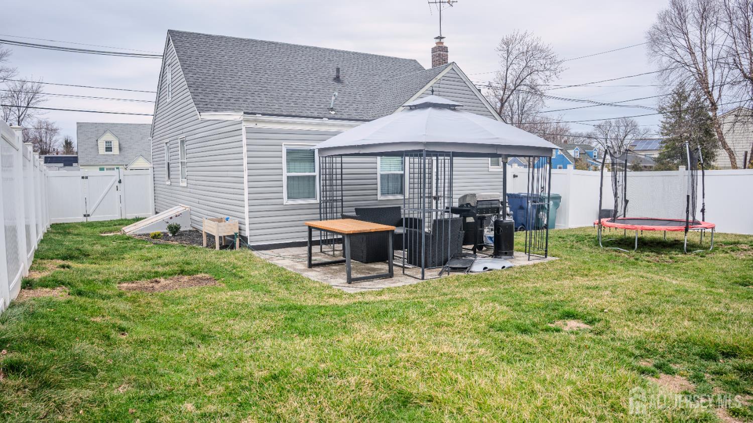 636 Lee Street Perth Amboy, NJ 08861 - Photo 18 of 35 a view of a house with backyard porch and sitting area